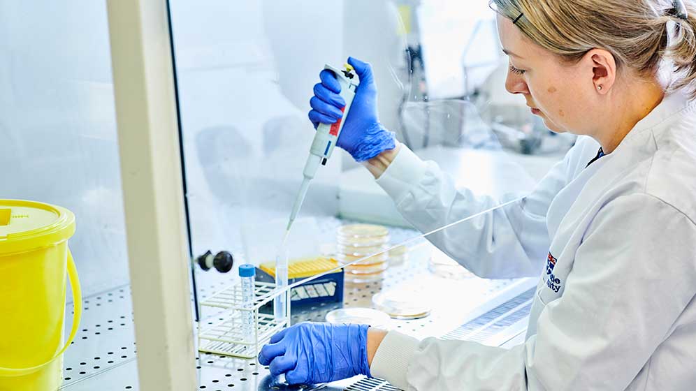 A researcher conducting an experiment in one of our labs.