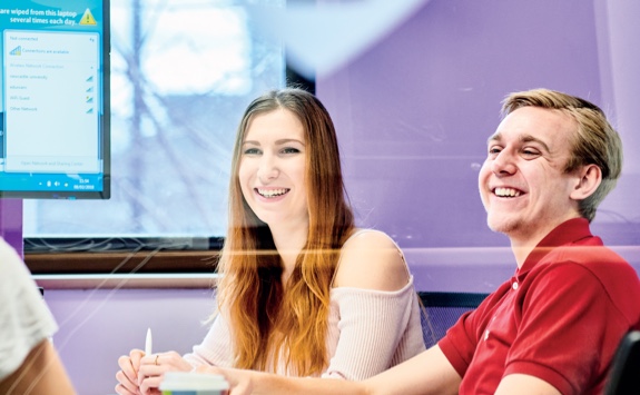 Students laughing in a learning space